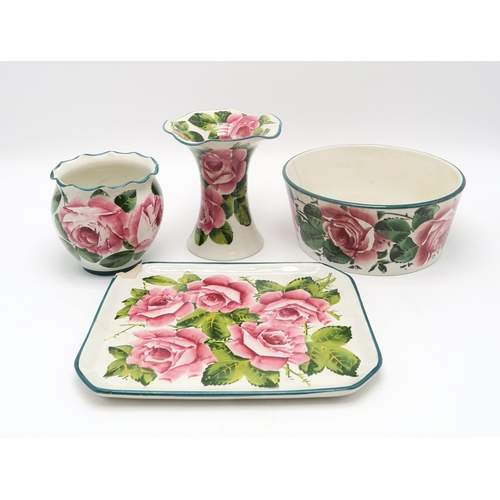 2250 - A SMALL GROUP OF WEMYSS WAREall painted with cabbage roses including a dog bowl, a tray, 26cm x 21cm... 