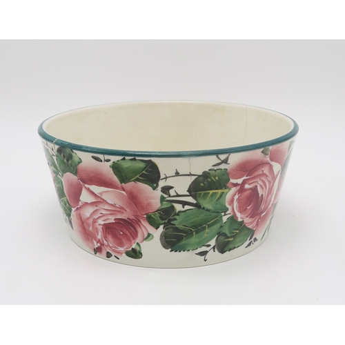 2250 - A SMALL GROUP OF WEMYSS WAREall painted with cabbage roses including a dog bowl, a tray, 26cm x 21cm... 