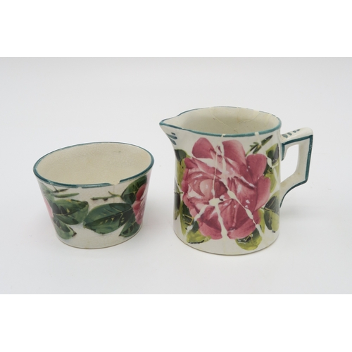 2251 - A COLLECTION OF WEMYSS WAREall painted with cabbage roses, including a cup and saucer, two other sau... 