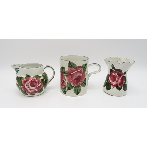 2253 - A COLLECTION OF WEMYSS WARE all painted with cabbage roses including a tankard 14cm high, a wavy rim... 