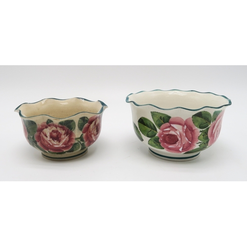 2253 - A COLLECTION OF WEMYSS WARE all painted with cabbage roses including a tankard 14cm high, a wavy rim... 