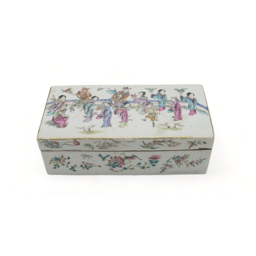 2379 - A CANTONESE RECTANGULAR PEN BOXPainted with figures within a fenced garden above insects and foliage... 