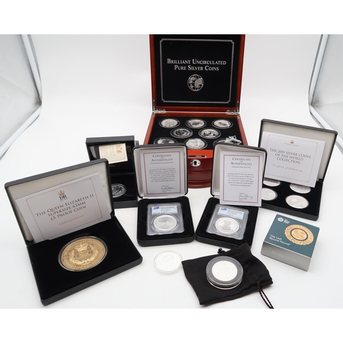 473 - Danbury Mint The World's Uncirculated Pure Silver Coins in collector's cabinet (8) together with var... 