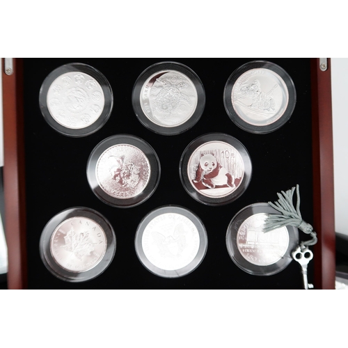 473 - Danbury Mint The World's Uncirculated Pure Silver Coins in collector's cabinet (8) together with var... 