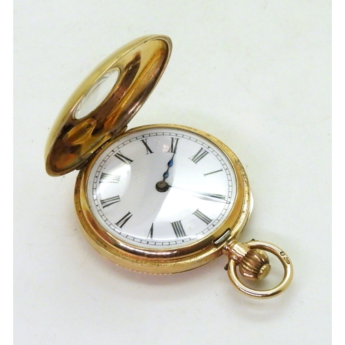 2911 - A LADIES HALF HUNTER FOB WATCHin 12ct gold with blue and gold enamelled chapter ring to the outer ca... 