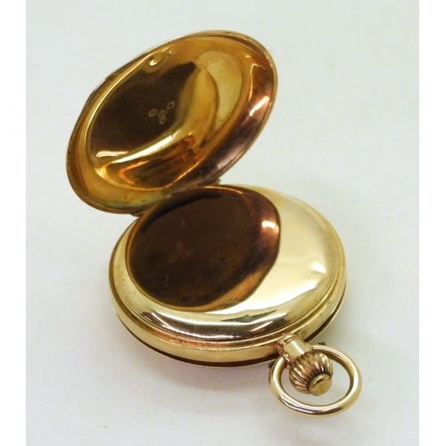 2911 - A LADIES HALF HUNTER FOB WATCHin 12ct gold with blue and gold enamelled chapter ring to the outer ca... 