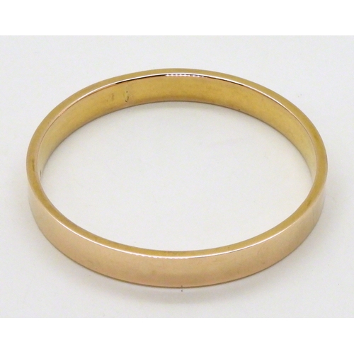 2780 - A 9CT GOLD UPPER ARM BANGLEhallmarked Chester 1922, inner diameter 7.4cm, weight 16.3gms... 