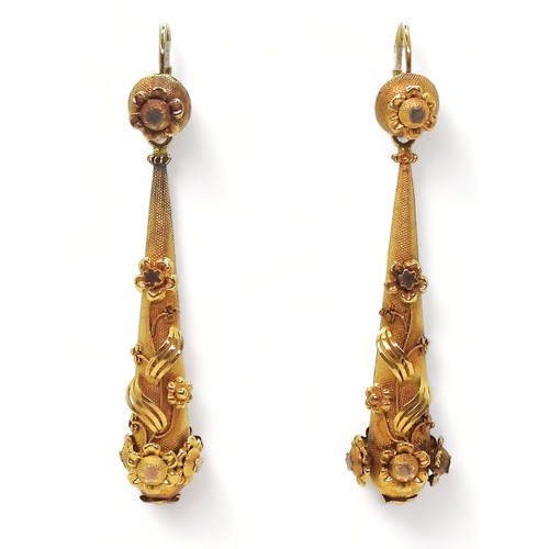 2706 - VINTAGE CONTINENTAL EARRINGSthe long drop yellow metal earrings have applied flower motifs, with con... 