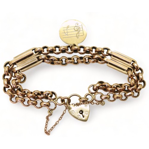 2733 - A VINTAGE BRACELETwith facet cut round links and double baton links a heart shaped clasp and medalli... 