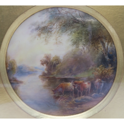 2263 - JOHN STINTON (1854-1956) A ROYAL WORCESTER PORCELAIN PLAQUEPainted with cattle by a river with a hil... 