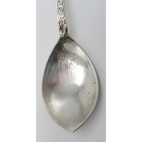 2510 - ALEXANDER RITCHIE; An Iona silver spoon, the petal-shaped bowl with floral decoration, the term... 