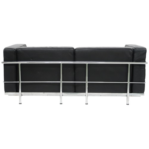 2101 - A 20TH CENTURY AFTER LE CORBUSIER TWO SEATER SETTEE with black leather cushions on chromed tubu... 