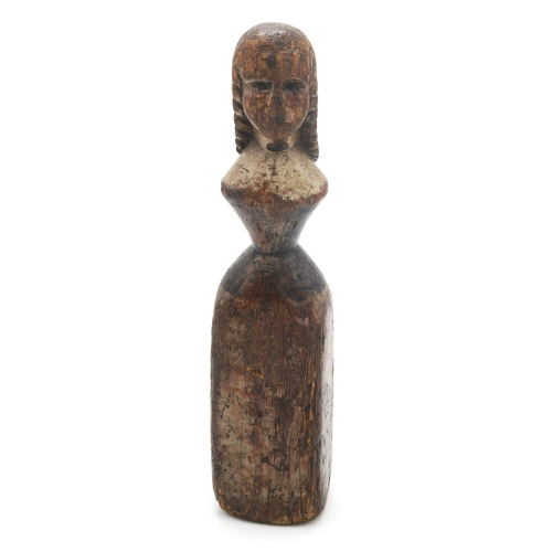 2629 - A FOLK ART CARVED AND PAINTED PINE FEMALE FIGUREPossibly a newel post finial, formed as a woman with... 