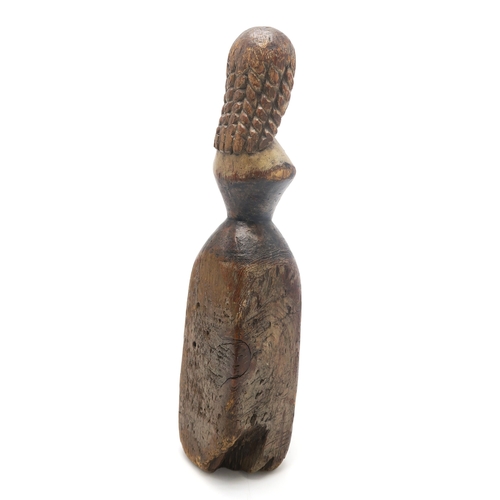 2629 - A FOLK ART CARVED AND PAINTED PINE FEMALE FIGUREPossibly a newel post finial, formed as a woman with... 