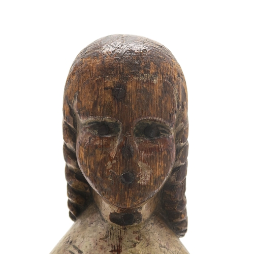 2629 - A FOLK ART CARVED AND PAINTED PINE FEMALE FIGUREPossibly a newel post finial, formed as a woman with... 