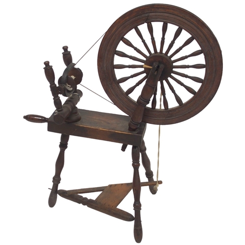 2038 - A 19TH CENTURY SCOTTISH SPINING WHEEL with 56cm turned spindle wheel on turned supports joined ... 