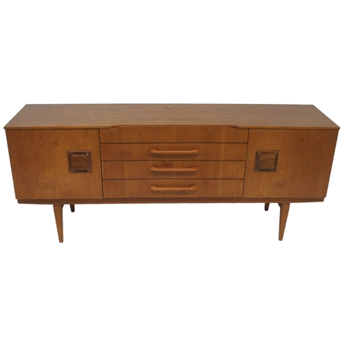 2095 - A MID 20TH CENTURY TEAK BEAUTILITY SIDEBOARD with four central drawers flanked by cabinet doors... 