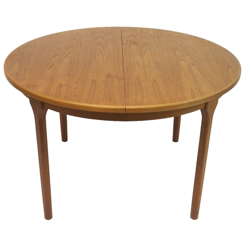 2104 - A MID 20TH CENTURY TEAK MCINTOSH CIRCULAR EXTENDING DINING TABLE AND FOUR CHAIRS dining table w... 