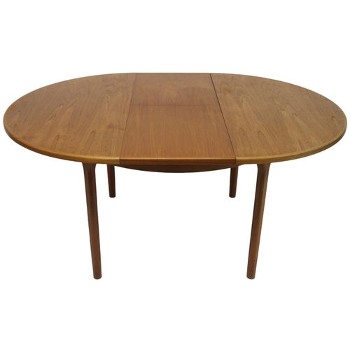 2104 - A MID 20TH CENTURY TEAK MCINTOSH CIRCULAR EXTENDING DINING TABLE AND FOUR CHAIRS dining table w... 