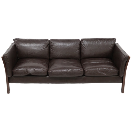 2106 - A 20TH CENTURY DANISH BROWN LEATHER UPHOLSTERED STOUBY THREE SEATER SETTEE with stained teak and lea... 