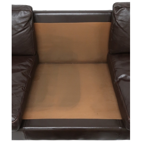 2106 - A 20TH CENTURY DANISH BROWN LEATHER UPHOLSTERED STOUBY THREE SEATER SETTEE with stained teak and lea... 