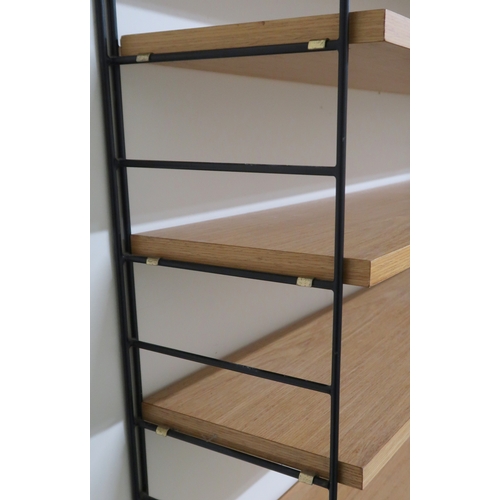 2107 - A MID 20TH CENTURY SWEDISH NISSE STRINNING, STRING MODULAR SHELVING SYSTEM comprising three ste... 