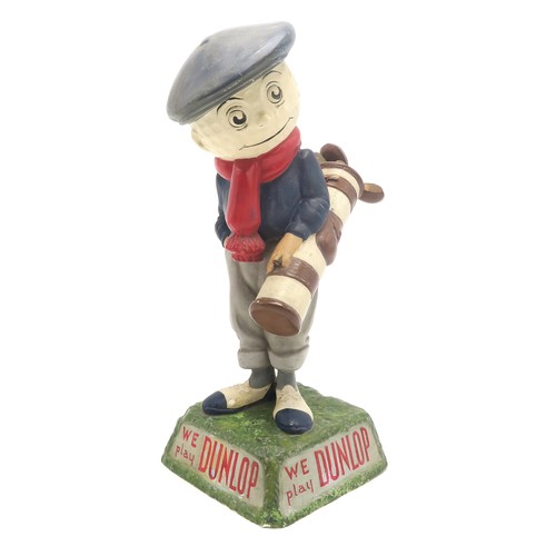 2634 - A DUNLOP CADDY PAPIER-MACHE GOLF BALL ADVERTISING FIGURE'We play Dunlop' to two sides of the natural... 