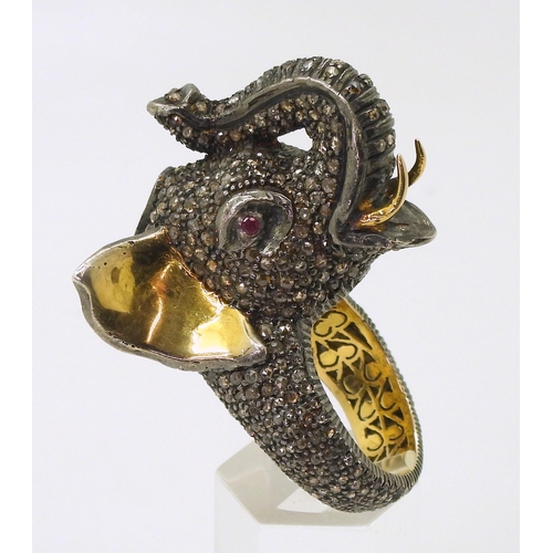 743 - A yellow and white metal elephant statement ring, entirely set with rose cut diamonds, with a polki ... 