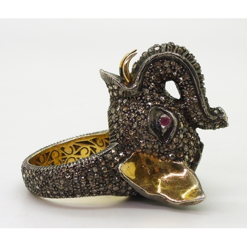 743 - A yellow and white metal elephant statement ring, entirely set with rose cut diamonds, with a polki ... 