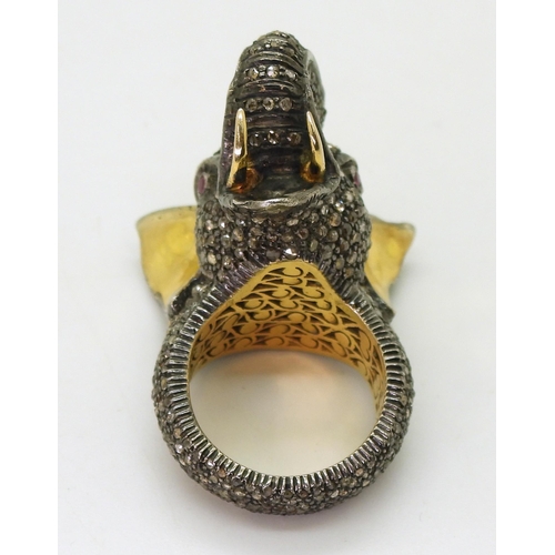 743 - A yellow and white metal elephant statement ring, entirely set with rose cut diamonds, with a polki ... 