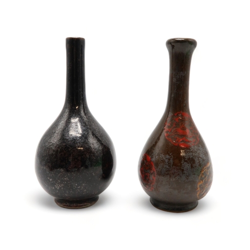 2388 - A MONOCHROME BOTTLE SHAPED VASEPainted with flaming pearl medallions, 18.5cm high, possibly Korean, ... 