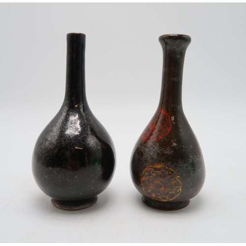 2388 - A MONOCHROME BOTTLE SHAPED VASEPainted with flaming pearl medallions, 18.5cm high, possibly Korean, ... 