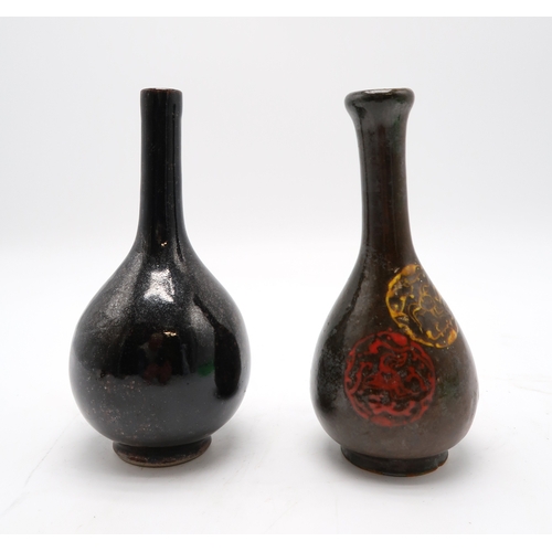 2388 - A MONOCHROME BOTTLE SHAPED VASEPainted with flaming pearl medallions, 18.5cm high, possibly Korean, ... 