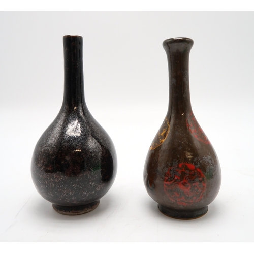 2388 - A MONOCHROME BOTTLE SHAPED VASEPainted with flaming pearl medallions, 18.5cm high, possibly Korean, ... 