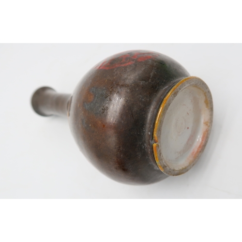 2388 - A MONOCHROME BOTTLE SHAPED VASEPainted with flaming pearl medallions, 18.5cm high, possibly Korean, ... 