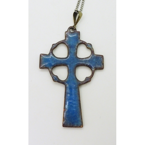 2799 - AN ARTS & CRAFTS STYLE PENDANTthe Celtic cross is made in copper and enamelled in blues and gree... 