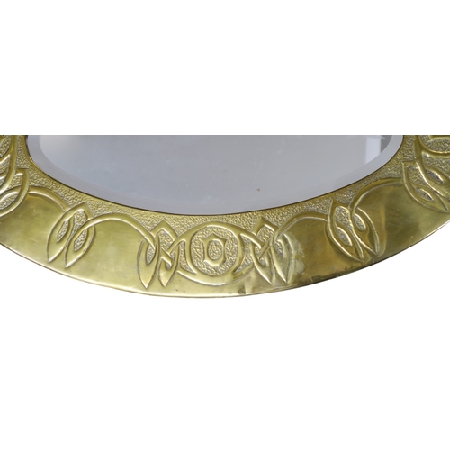 2267 - A GLASGOW SCHOOL ARTS AND CRAFTS WALL MIRRORof oval form with Celtic knotwork decoration, 77cm long... 