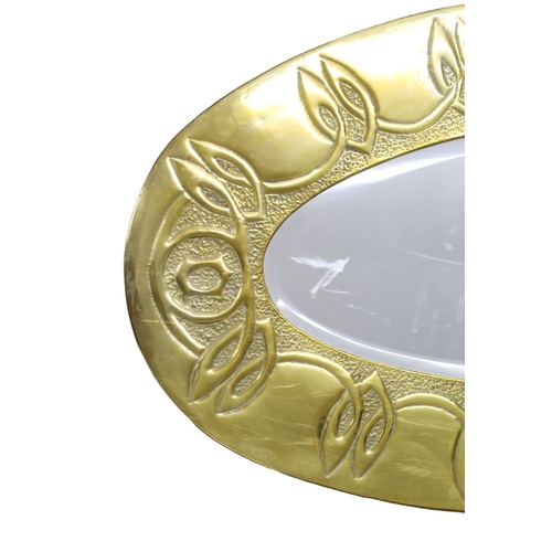 2267 - A GLASGOW SCHOOL ARTS AND CRAFTS WALL MIRRORof oval form with Celtic knotwork decoration, 77cm long... 