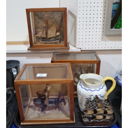 105 - Three cased model boats, a pair of ship theme bookends together with a Royal Doulton Sea Shanty jug