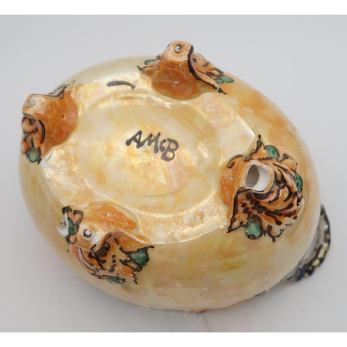 144 - Ann Macbeth (1875-1948)  - A two handled lidded dish, painted with flowers, initials F.M and da... 