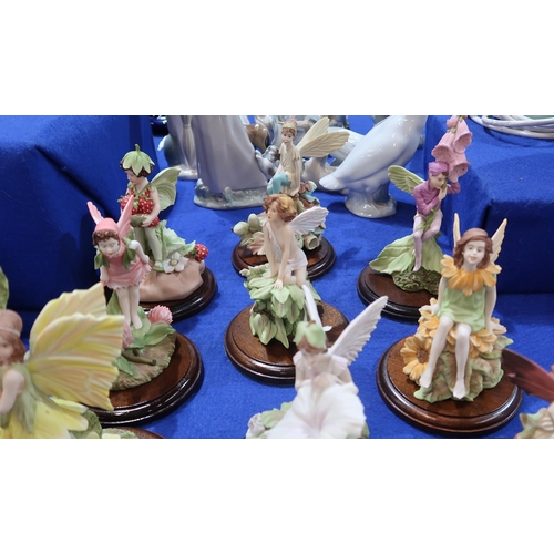 148 - A collection of twelve Danbury Mint Cicely Mary Barker Flower Fairies figures