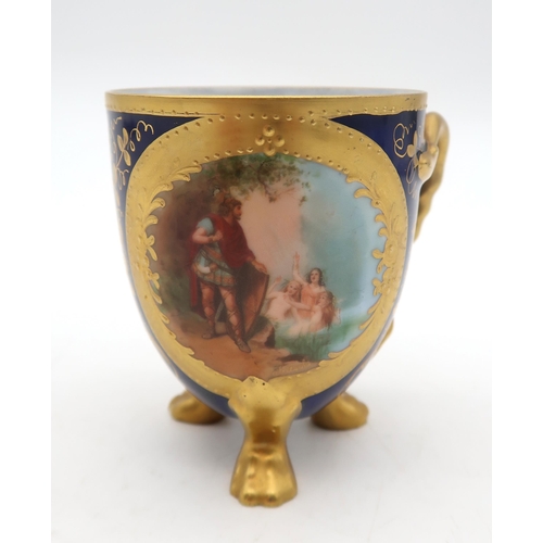 149 - A continental porcelain cup, transfer printed with a scene of Siegfried and the Rhine daughters and ... 