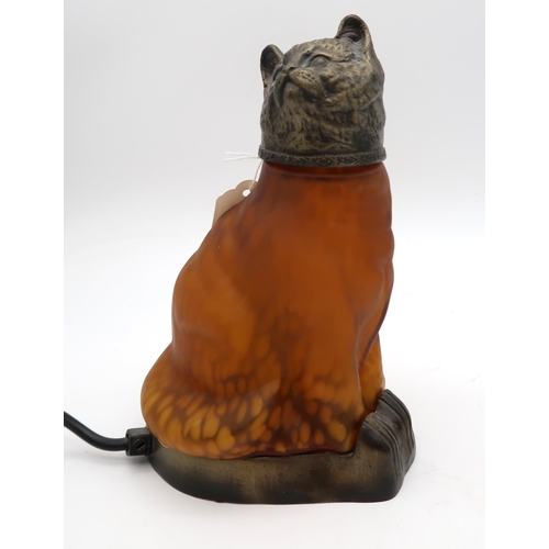 152 - A glass and metal cat lamp with black and white mottled effect and another in amber glass