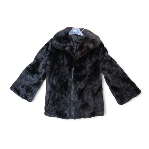 172 - A short black fur jacket