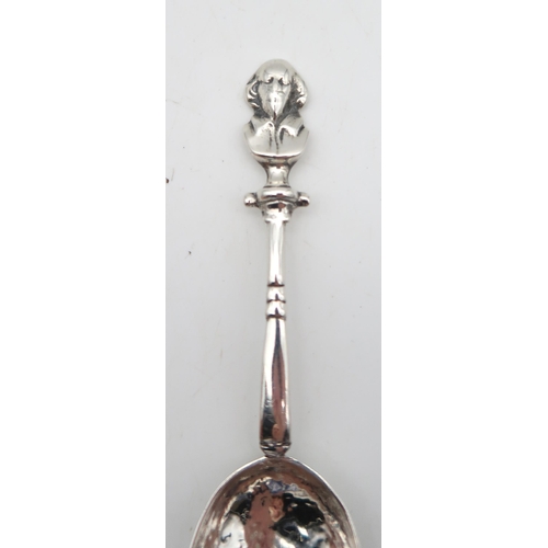 205 - An Arts and Crafts silver spoon, by Winifred King & Co, Birmingham 1927, with a hammered and poi... 