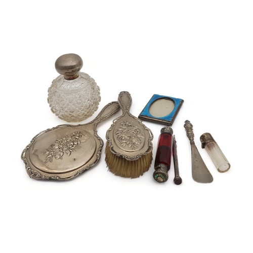 209 - A collection of silver including a part dressing set, by Henry Matthews, Birmingham, decorated with ... 