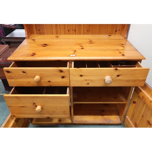 46 - A 20th century pine estate built kitchen cabinet with pair of cabinet doors over open plate rack on ... 