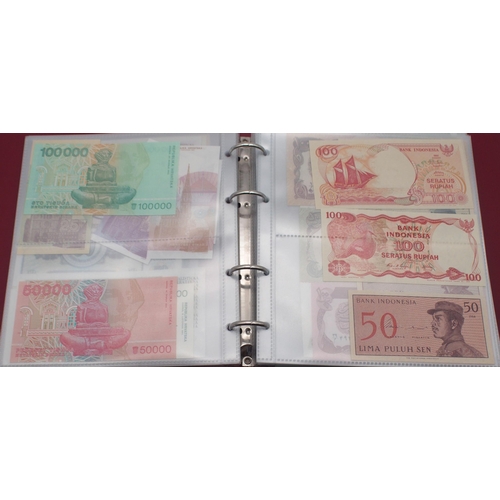 243 - A collection of worldwide bank notes with Eastern Bloc and Asian continent examples