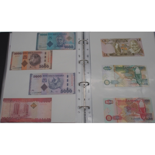 244 - A collection of worldwide banknotes with examples from North Korea, Iraq, Syria, The Islamic Republi... 