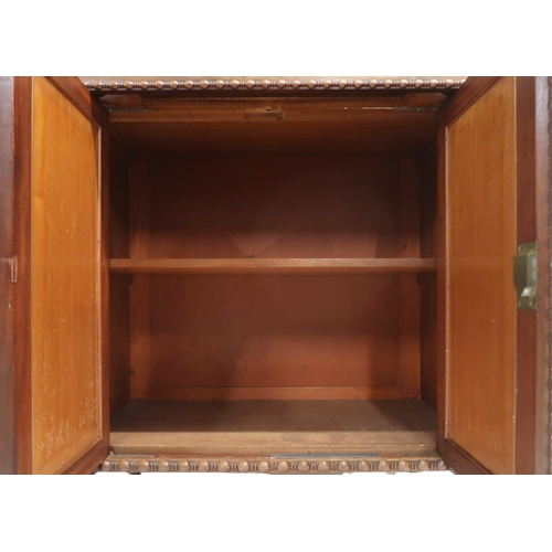 2045 - A 20TH CENTURY MAHOGANY REGENCY STYLE CHIFFONIERwith two open shelves flanked by carved scrolled upr... 